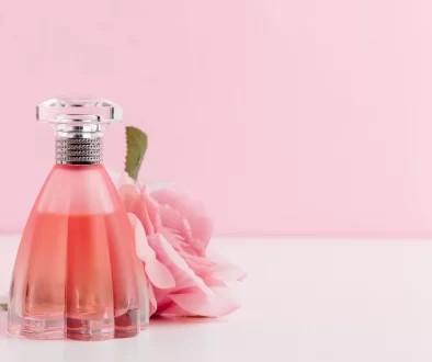 bottle-of-perfume-with-flowers-on-color-background-2021-09-03-10-32-01-utc